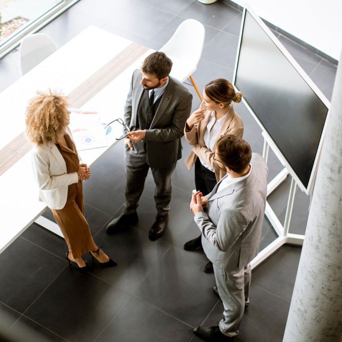 overhead-view-group-multiethnic-business-people-working-together-office